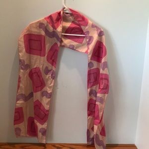 Elissa modern print silk scarf 10” x 68”. Hand wash or dry clean.